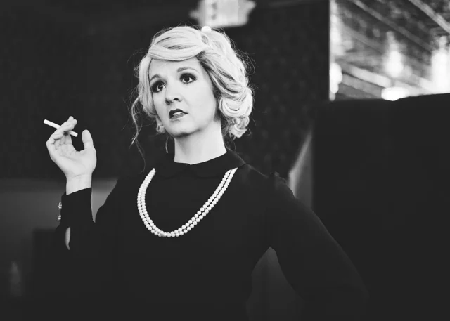 Black-and-white portrait of Lia in a vintage outfit
