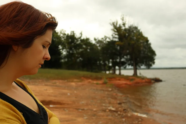 Lia in profile by a lake