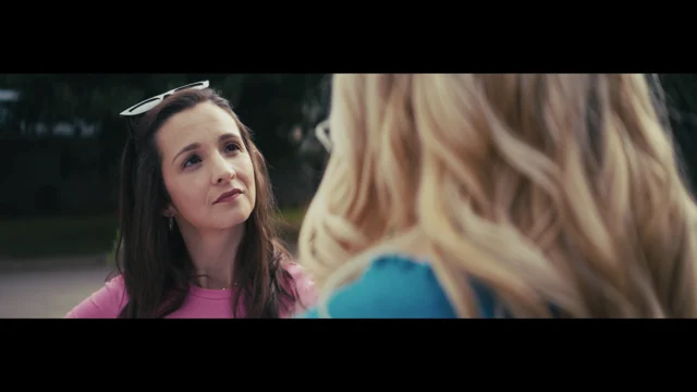 Lia in a pink top in an outdoor scene