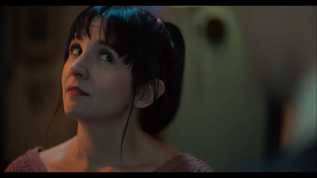 Lia looking upward in a dramatic scene