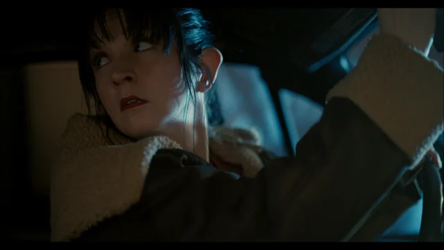 Lia in a car scene in Vampire, Esq.