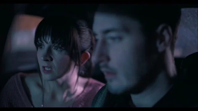 Lia in a car scene with Cain Graham in Vampire, Esq.