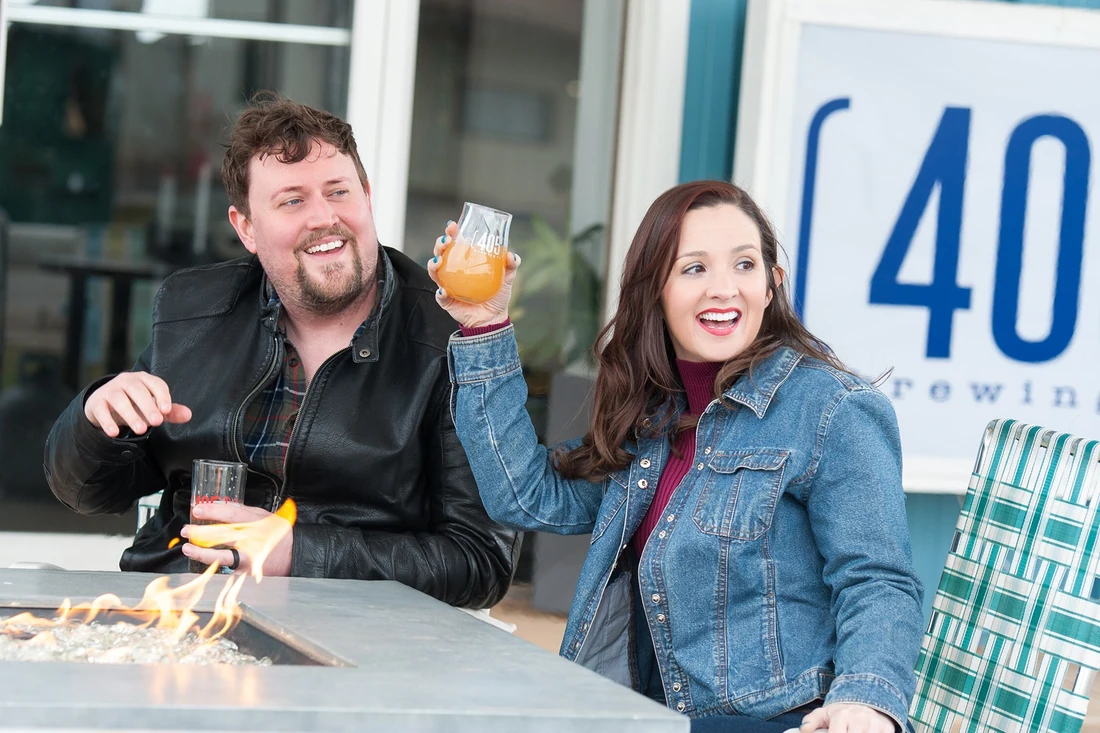 Lia and another model smiling toward the camera at 405 Brewing